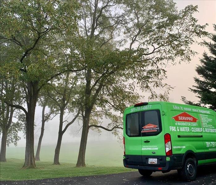 SERVPRO of Washington County truck parked near trees in foggy area