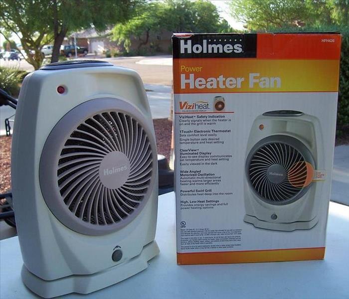 Heater fan with a box next to it